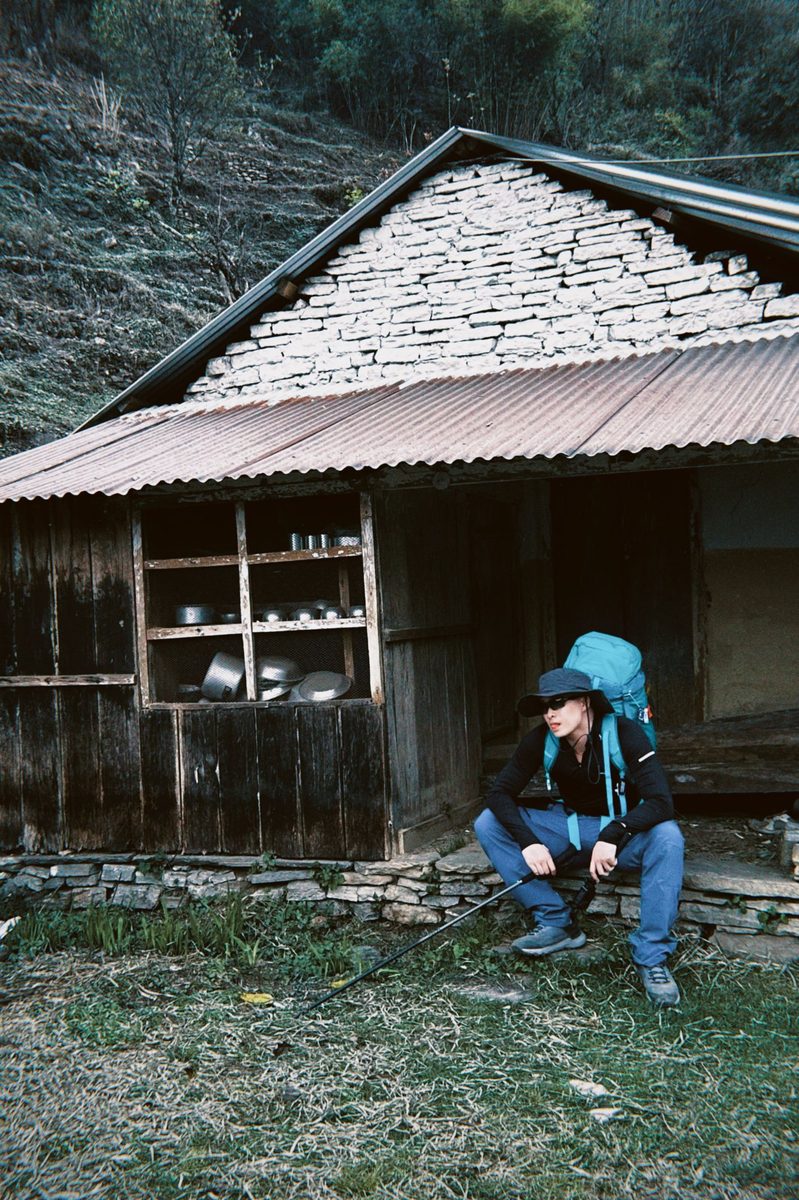 Resting by stone house