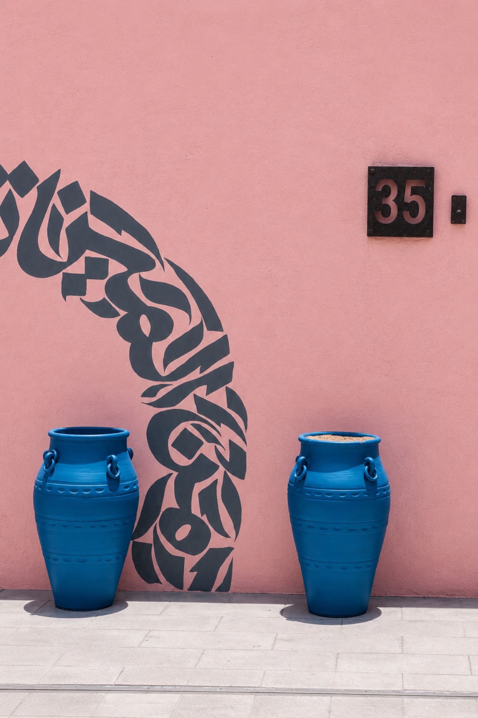 Blue pots and calligraphy wall