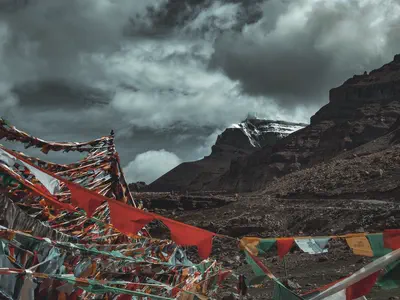 Prayer flags and a mountain peak in Tibet, China