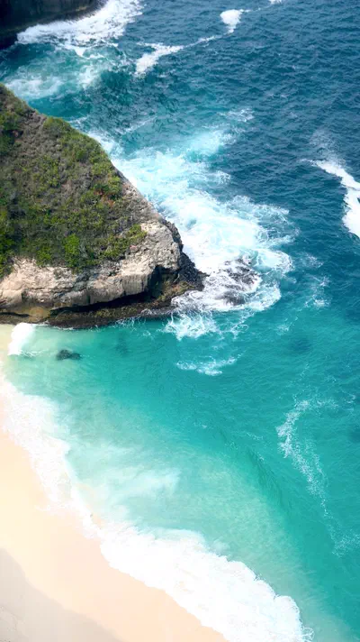 Aerial view of the cliffs and turquoise coast of Nusa Penida, Indonesia