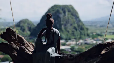 A Buddha silhouette and karst mountains in Vietnam