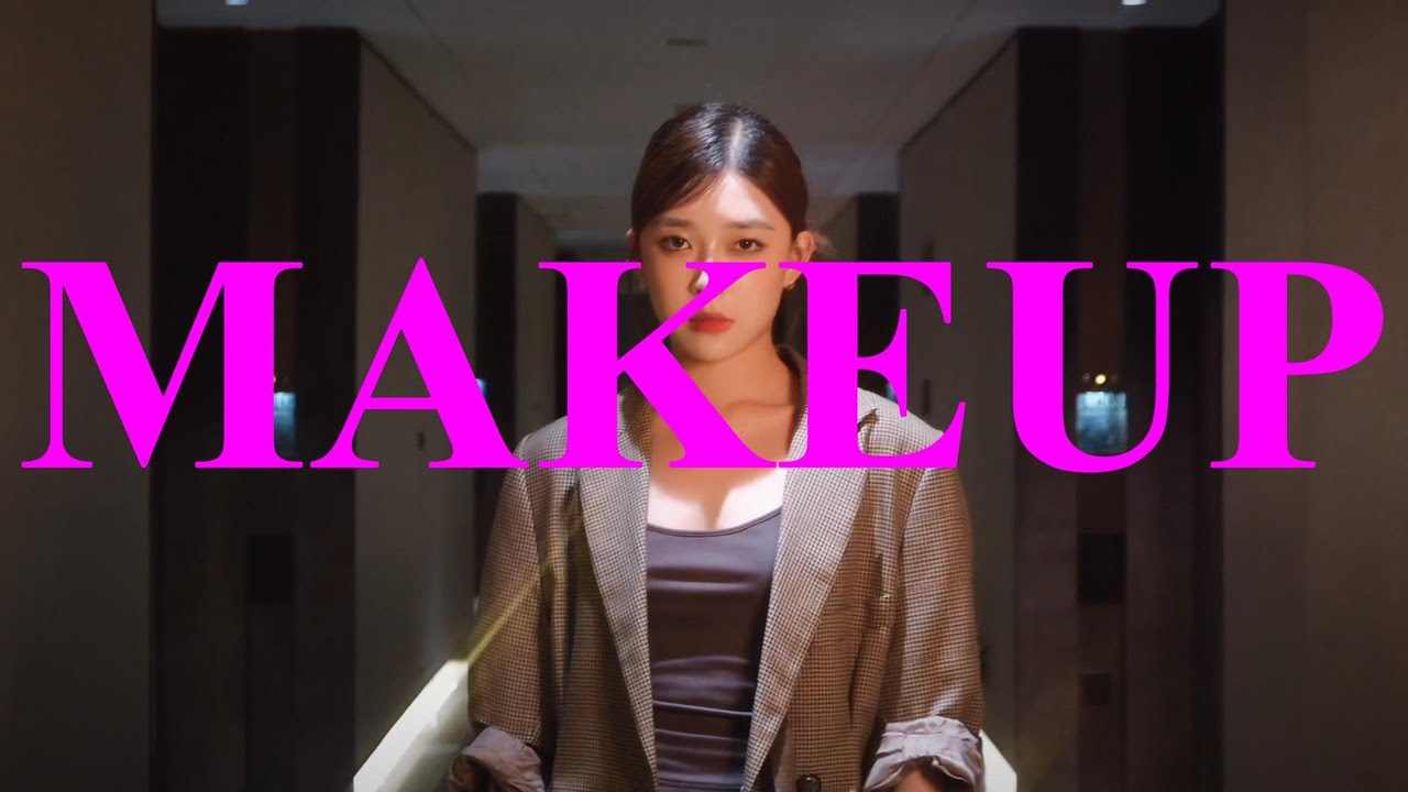 Makeup poster with a woman in a corridor behind bright pink title text