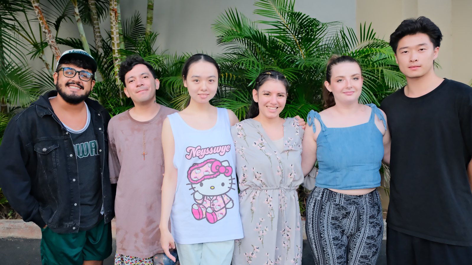 Six dancers of the University of Hawaiʻi at Mānoa dance program standing together outdoors